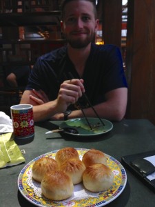 Eating one of Rob's favorite foods, Baozi in China. A dream come true.