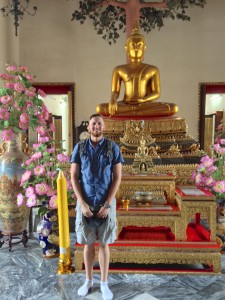 Alex with a small Buddha shrine.
