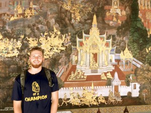 Alex with a mural at Wat Phra Kaew in central Bangkok.